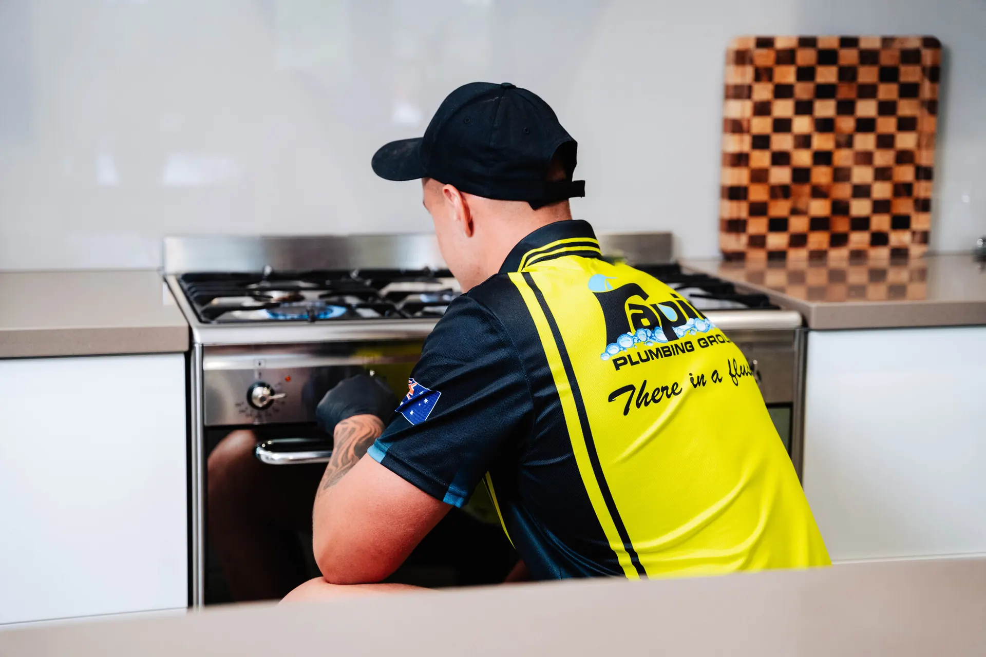 Licensed gas fitter working on a residential gas system