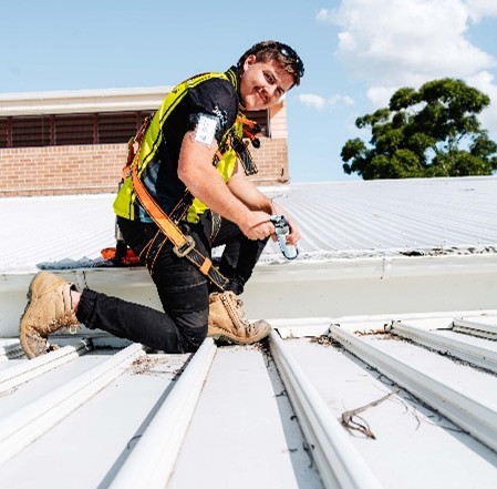Commercial metal roof and gutter works in progress