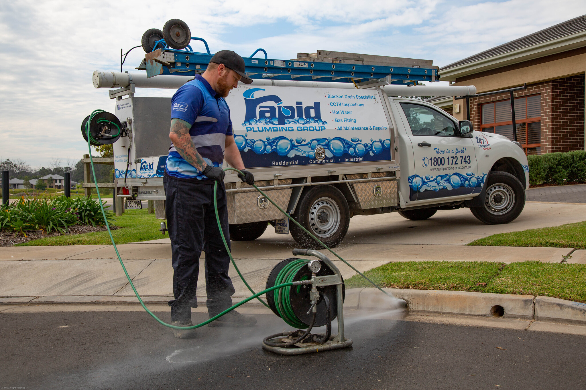 Plumber clearing a blocked drain